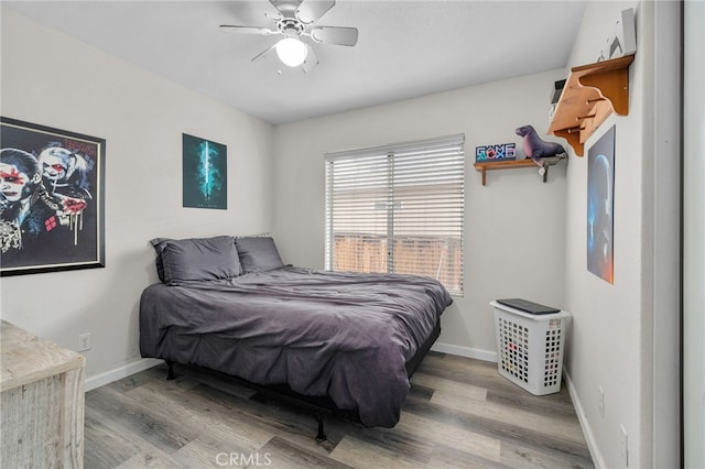 bedroom with ceiling fan and wood-type flooring