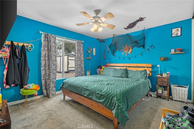 bedroom with ceiling fan and carpet