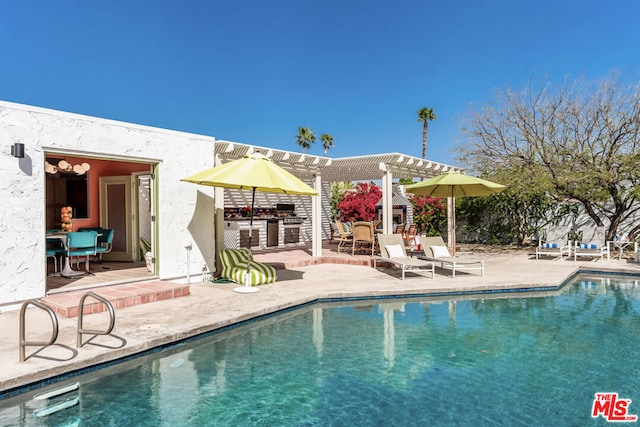 view of swimming pool featuring a pergola and a patio area