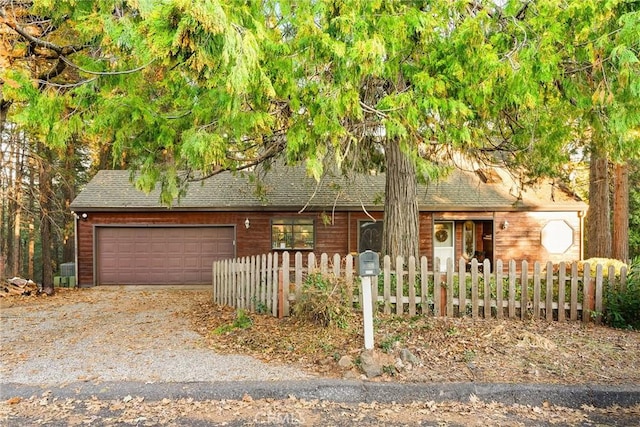 obstructed view of property featuring a garage