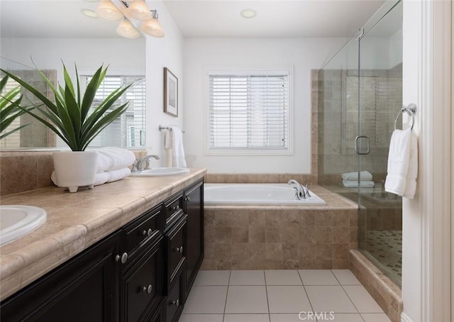 bathroom with separate shower and tub, vanity, and tile patterned floors