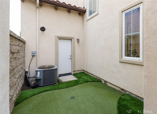 doorway to property featuring central AC