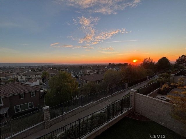 view of balcony at dusk