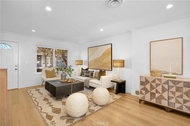 sitting room with hardwood / wood-style flooring