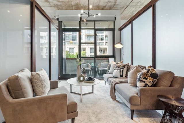 carpeted living room featuring a notable chandelier and floor to ceiling windows