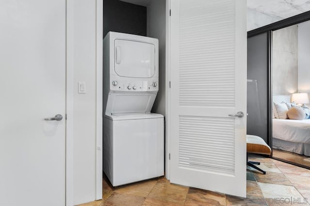 laundry room with stacked washer and dryer