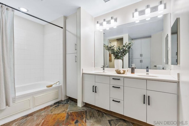 bathroom with vanity and shower / bath combo with shower curtain