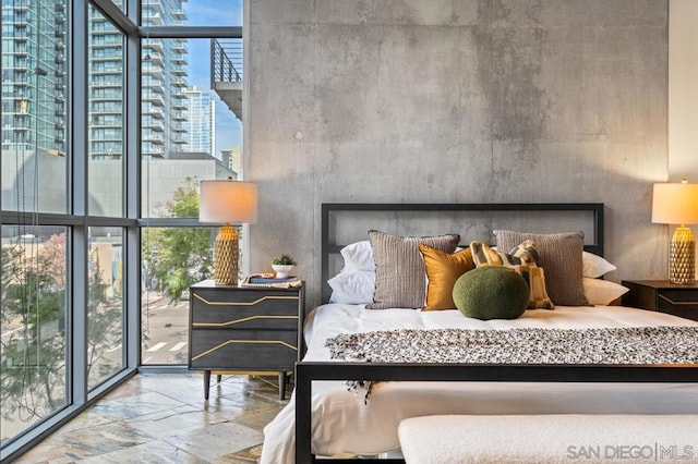 bedroom featuring floor to ceiling windows