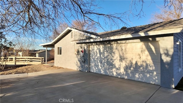 view of side of home with a garage