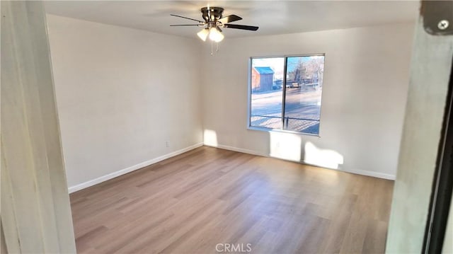 unfurnished room with ceiling fan and light hardwood / wood-style flooring