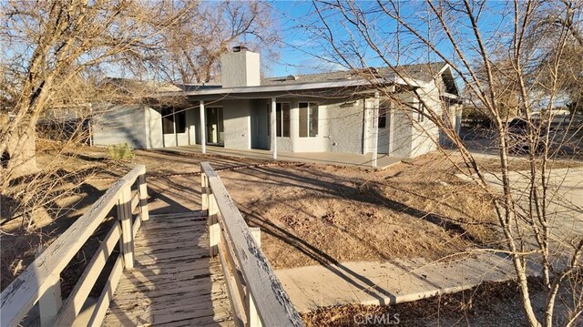 back of house featuring a patio