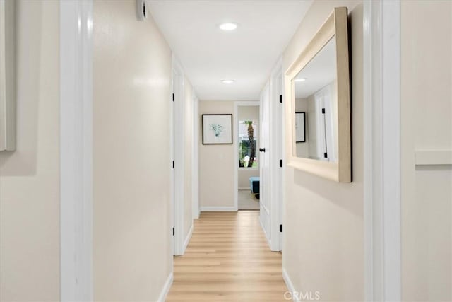 hall with light hardwood / wood-style floors