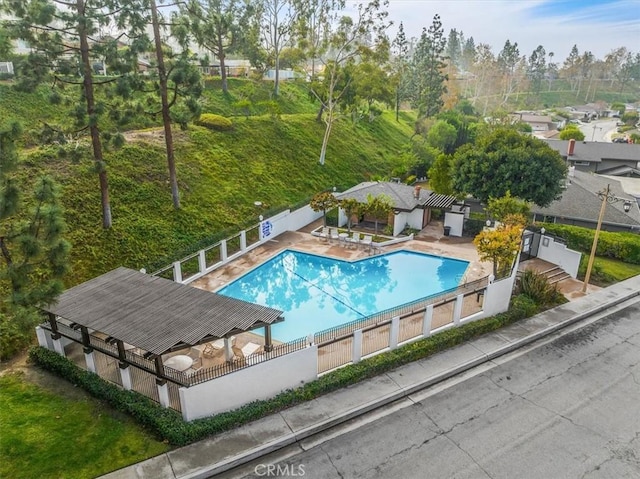 view of pool featuring a pergola and a patio