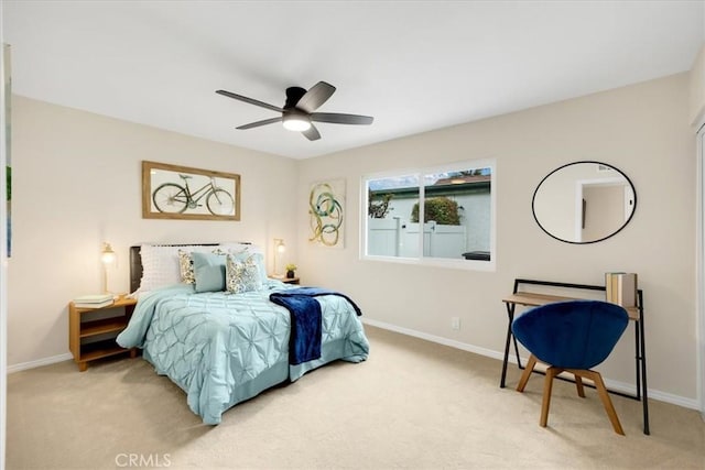 bedroom featuring ceiling fan and light carpet