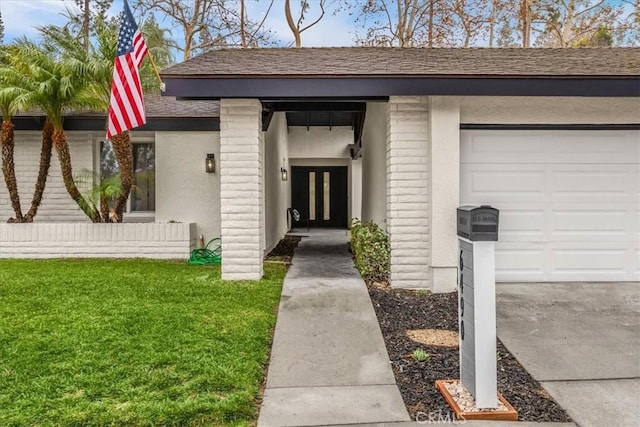 property entrance with a garage and a lawn