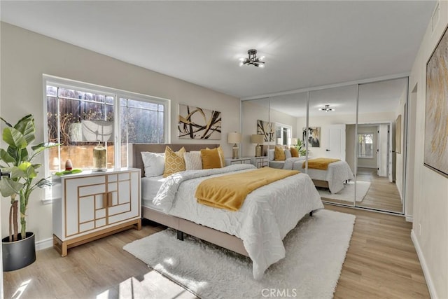 bedroom with light wood-type flooring