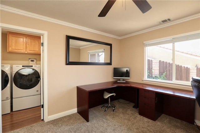 office space featuring washer and dryer, crown molding, light carpet, and ceiling fan