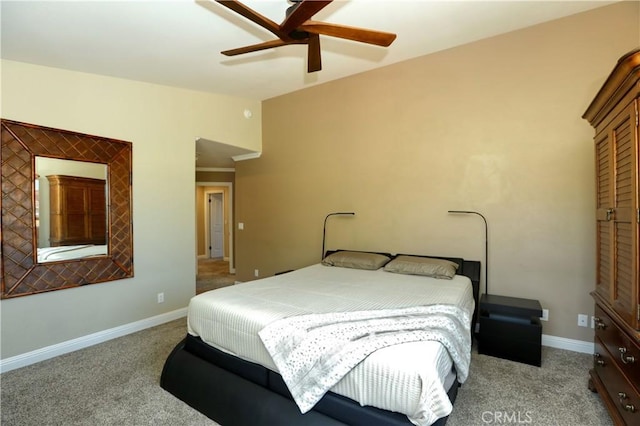 bedroom featuring light carpet and ceiling fan