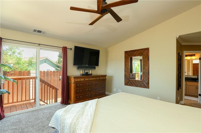 bedroom with lofted ceiling, carpet floors, access to outside, ceiling fan, and ensuite bathroom