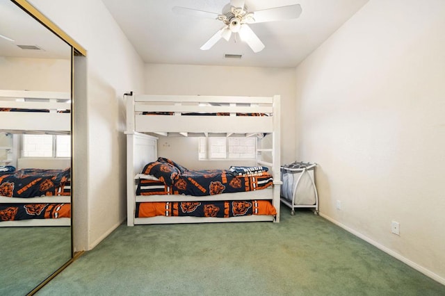 bedroom featuring ceiling fan, carpet, and a closet