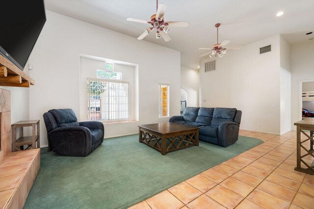 tiled living room featuring ceiling fan