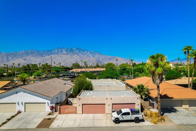 birds eye view of property with a mountain view