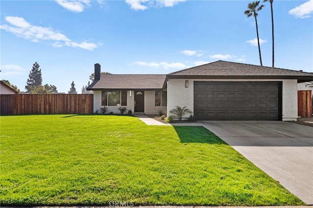 ranch-style house featuring a front yard and a garage