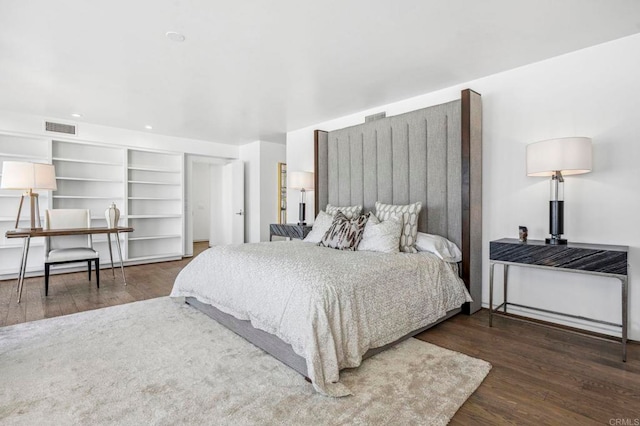 bedroom featuring dark wood-type flooring