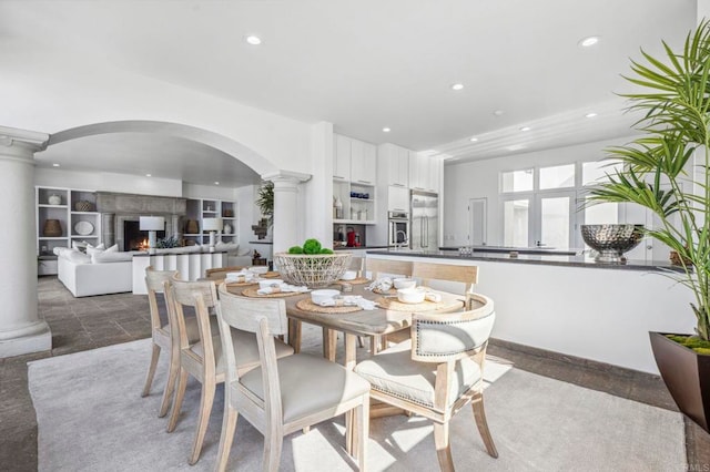 dining space with ornate columns