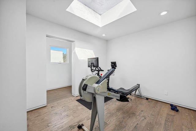 workout area with light wood-type flooring