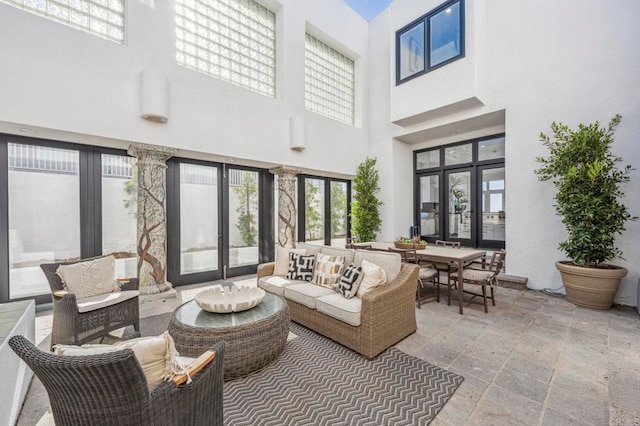 view of patio / terrace with an outdoor living space and french doors