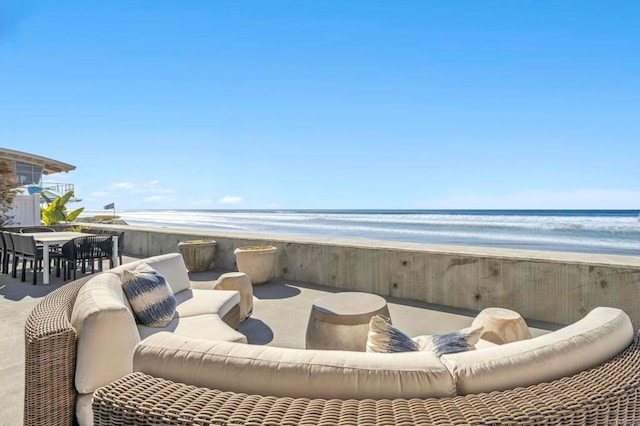 view of patio with a view of the beach and a water view