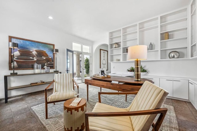 sitting room featuring decorative columns