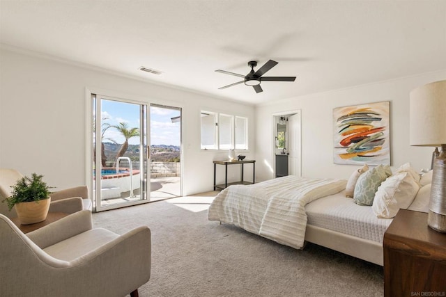 carpeted bedroom with access to outside, ceiling fan, and ornamental molding