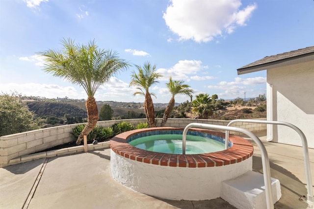 view of pool featuring an in ground hot tub