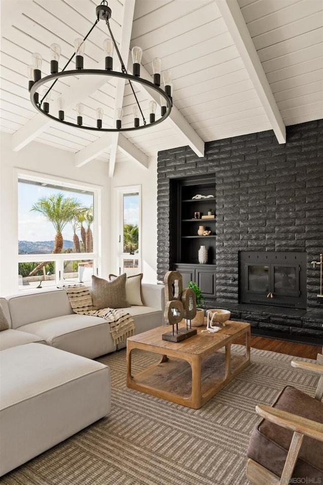 interior space featuring beam ceiling, a fireplace, and hardwood / wood-style floors