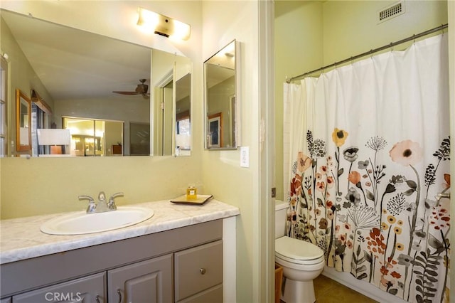 bathroom with toilet, vanity, ceiling fan, vaulted ceiling, and curtained shower