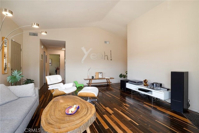 living room with dark hardwood / wood-style flooring and lofted ceiling