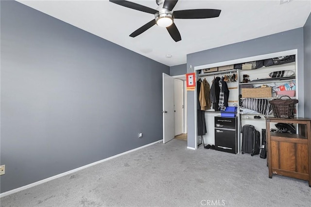 unfurnished bedroom featuring ceiling fan, a closet, and light colored carpet