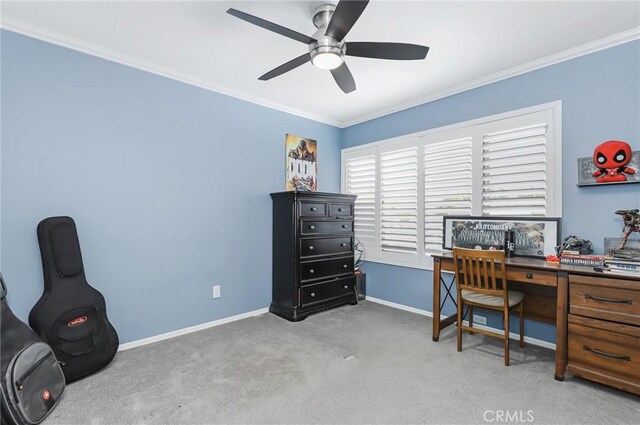 office space featuring ceiling fan, light colored carpet, and ornamental molding