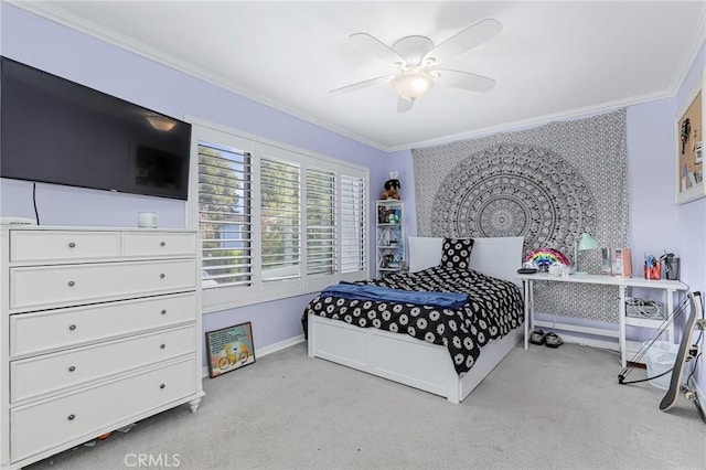 carpeted bedroom featuring ceiling fan and ornamental molding