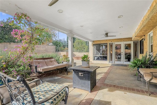 view of patio / terrace featuring ceiling fan and french doors