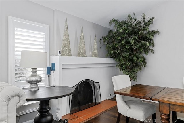 dining space with dark wood-type flooring