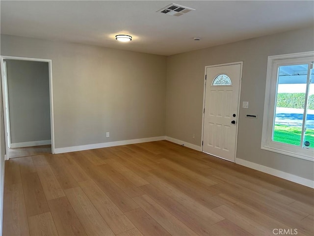 foyer entrance with light wood-type flooring