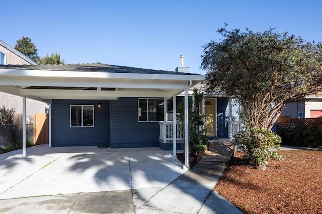 view of front of property featuring a carport