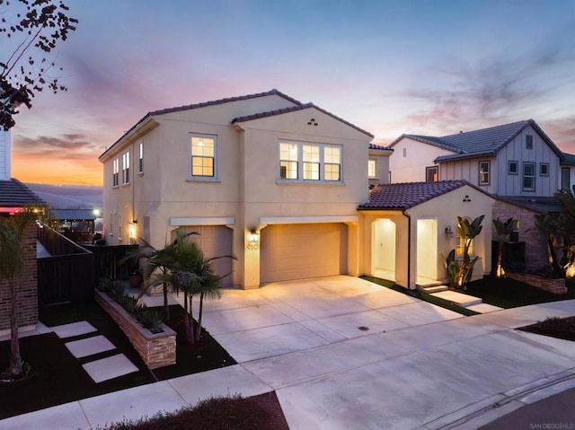 mediterranean / spanish house featuring a garage