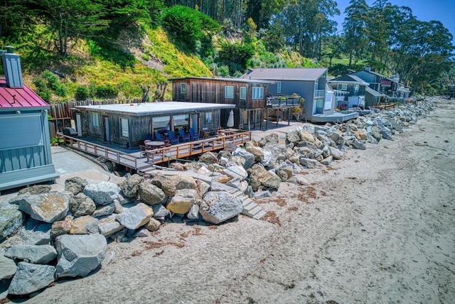 back of property featuring a wooden deck