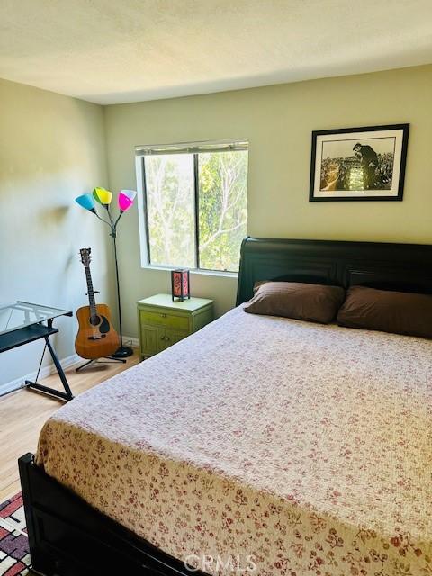 bedroom with light hardwood / wood-style flooring