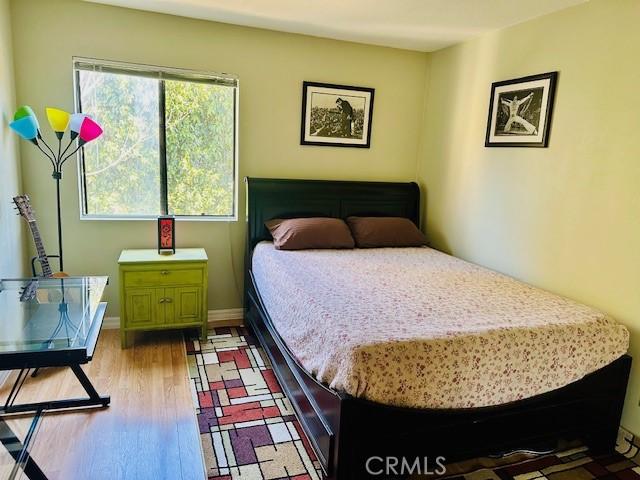 bedroom featuring hardwood / wood-style flooring