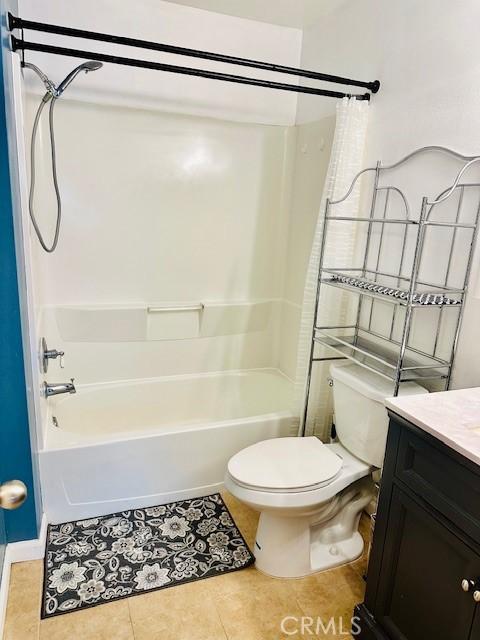 full bathroom with toilet, tile patterned flooring, shower / washtub combination, and vanity